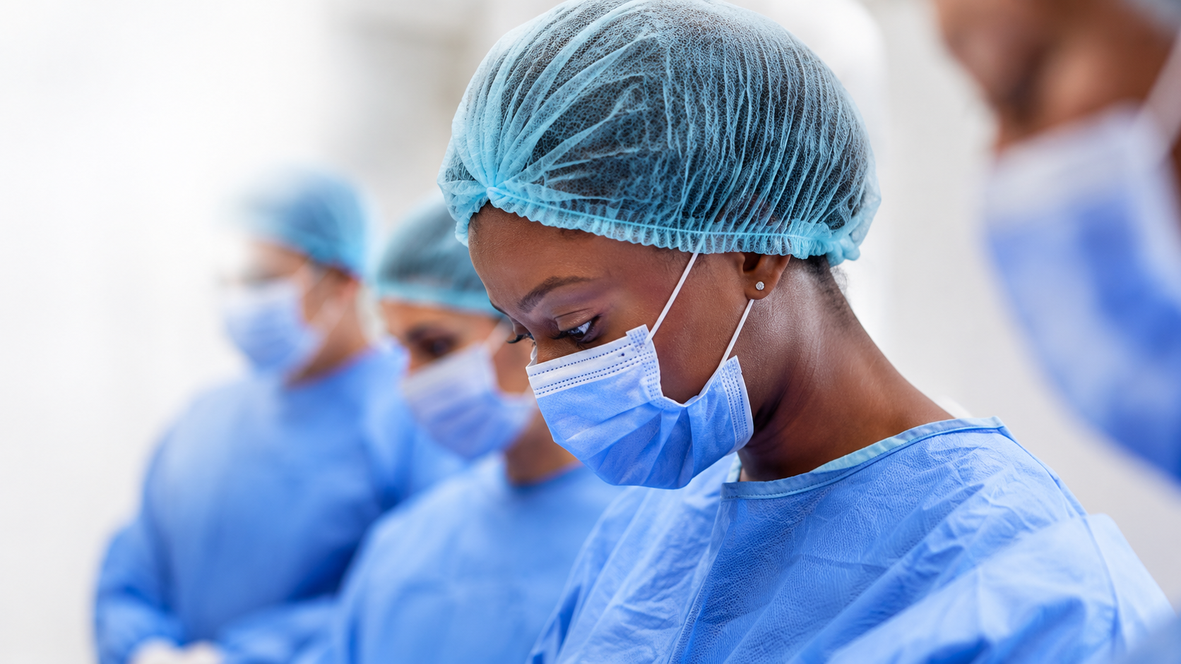 Surgical team in a bright operating theatre